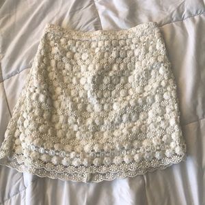Divided mini white crochet skirt